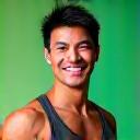 Portrait of David Chen, a fit and encouraging fitness coach in his 40s or 50s.