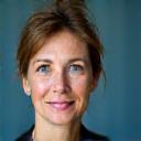 Portrait of Sara Johnson, a compassionate and knowledgeable therapist in her 40s or 50s.